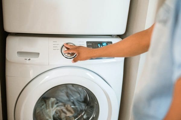 person using washing machine
